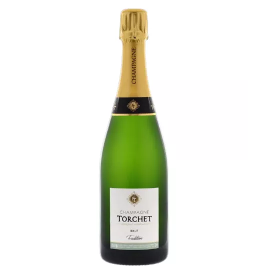 Bouteille de Champagne LAËTITIA TORCHET Brut Tradition en service.
